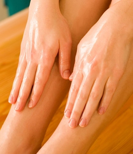 Two clean glowing hands resting gently on legs — symbolizing body nourishment, self-care, and touch-based healing