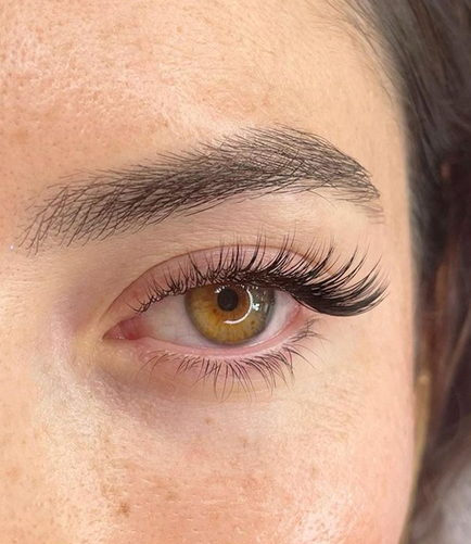 Close-up of a left eye with long, thick, defined lashes — symbolizing healthy lash growth and eye vitality