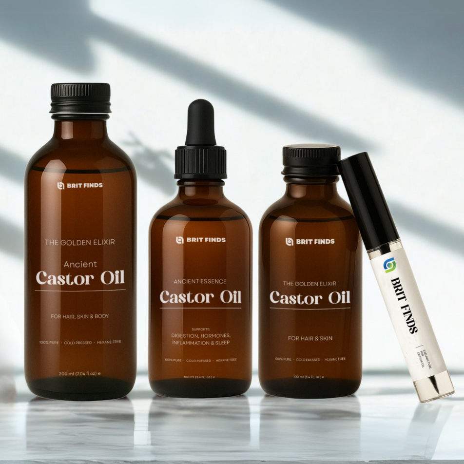 Brit Finds full castor oil range displayed in a minimalist natural light setting – featuring 100% pure, cold-pressed castor oils for hair, skin, digestion, inflammation, and sleep, along with an eyelash tube with eyelash wand in it  – perfect for holistic beauty and wellness.