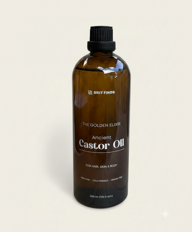 Main product display of 200ml castor oil in an amber glass bottle against a plain background, highlighting the premium quality and natural purity of the cold-pressed castor oil.