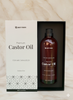 Display of 200ml castor oil bottle and its box placed on a marble surface, showcasing the elegant packaging and premium quality of the natural cold-pressed castor oil.
