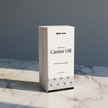 200 ml Castor Oil box in white color placed on a white and grey marble surface — clean and minimal product display 
